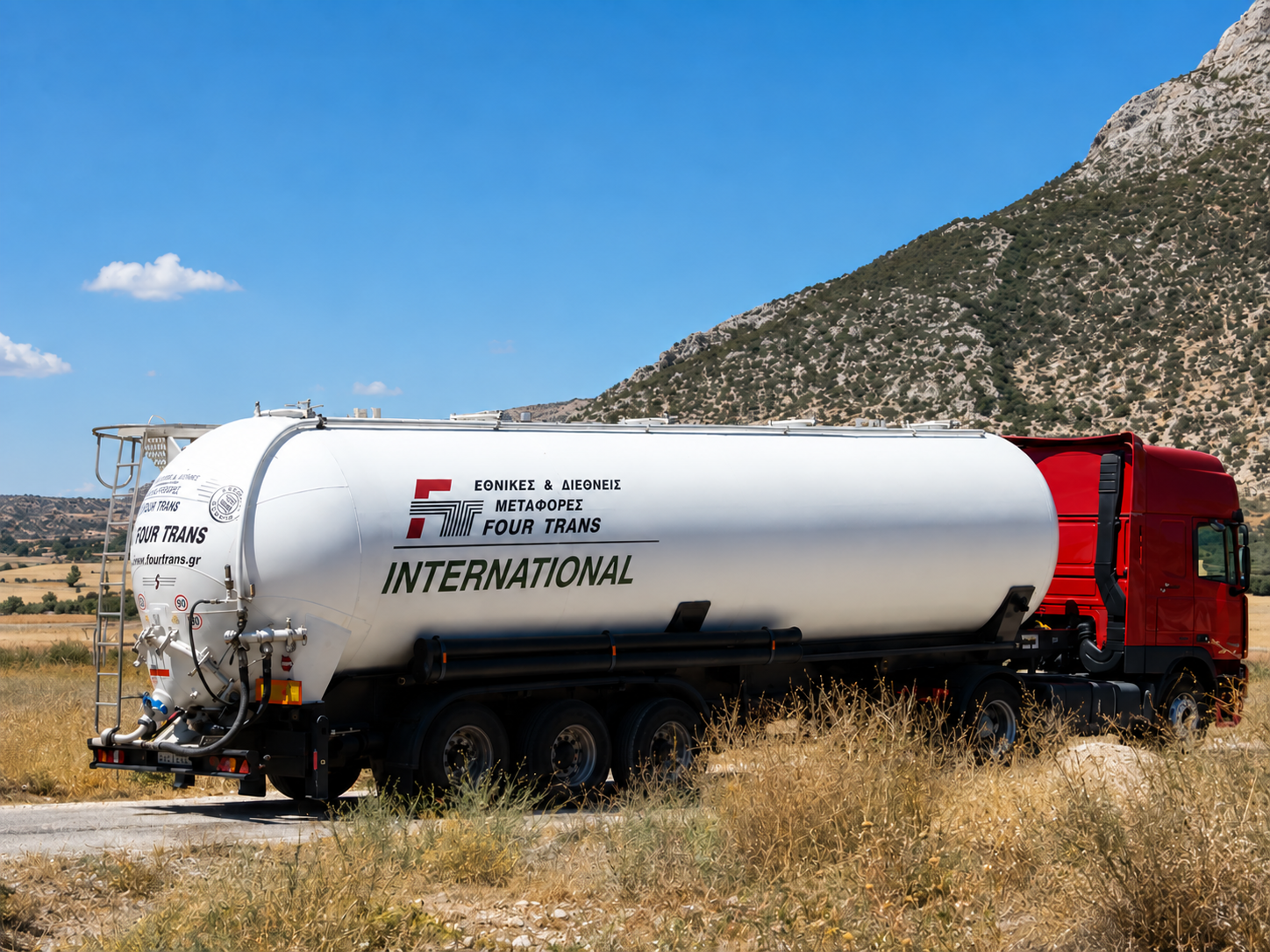 Four Trans silo tanker in a mountain landscape